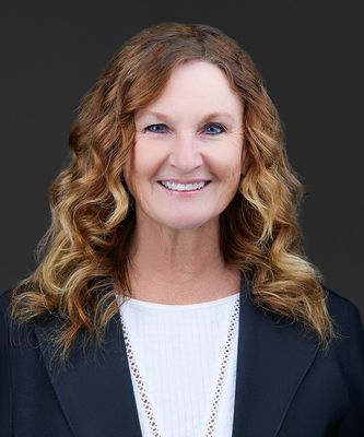 Portrait of Sandy Gustaveson, Managing Broker